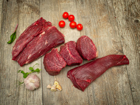 Beef tenderloin cut into steaks